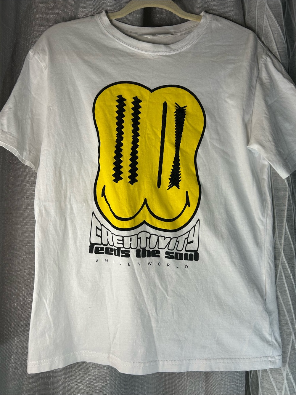 H&M White T‑Shirt with Yellow Smiley and Black Accents